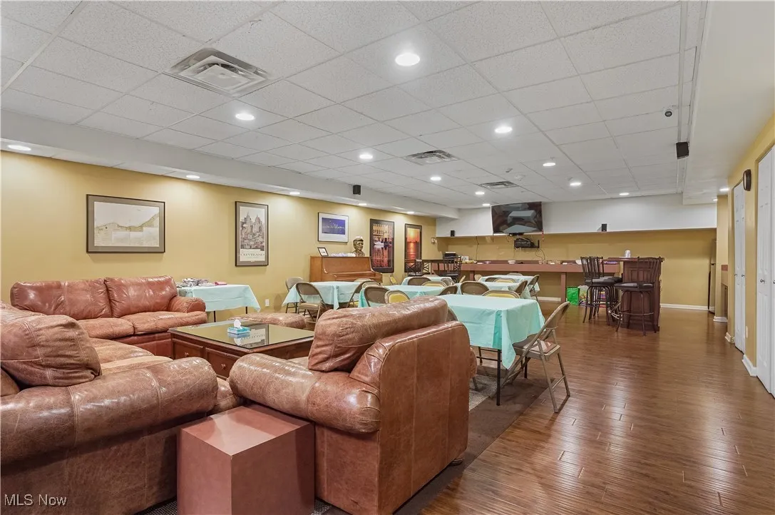 entable community room with pool table, lounge and bar area