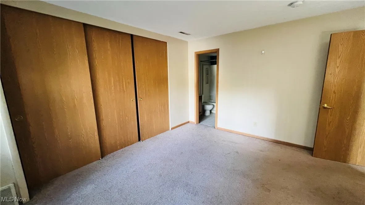Large Bedroom featuring carpet and large closet