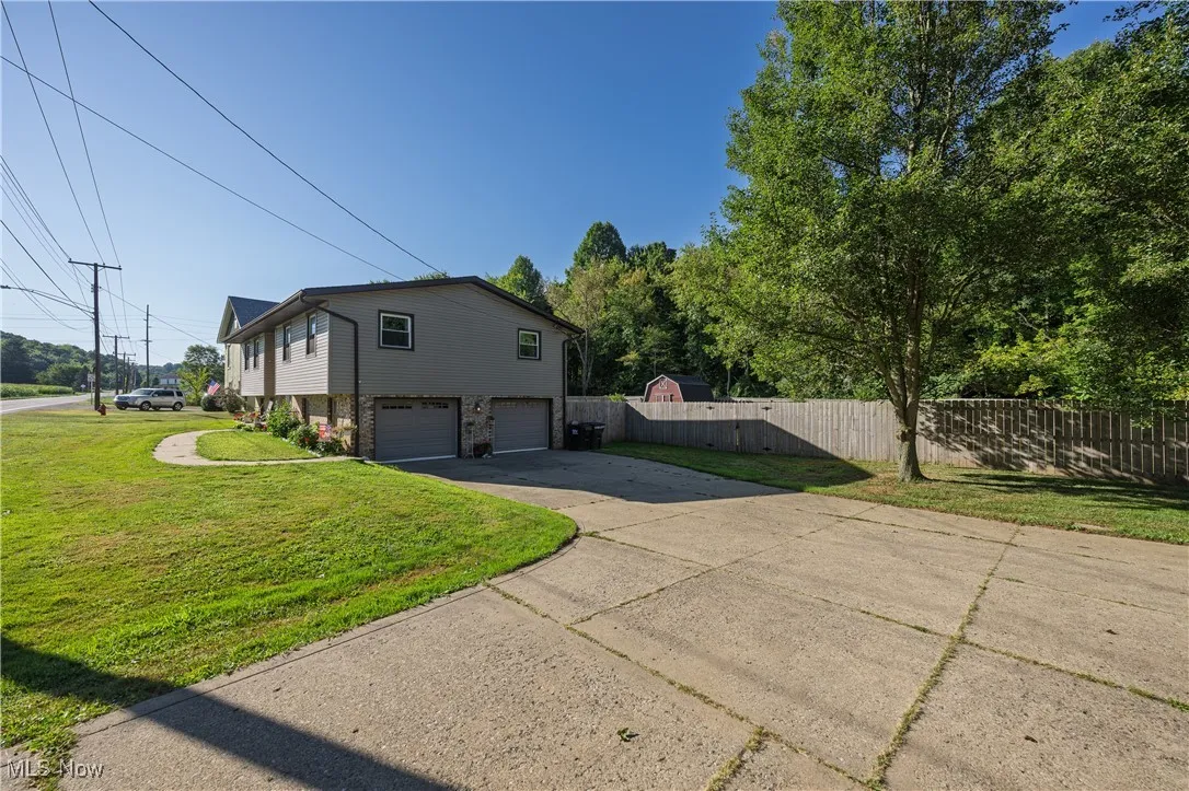 View of home's exterior featuring driveway and a garage