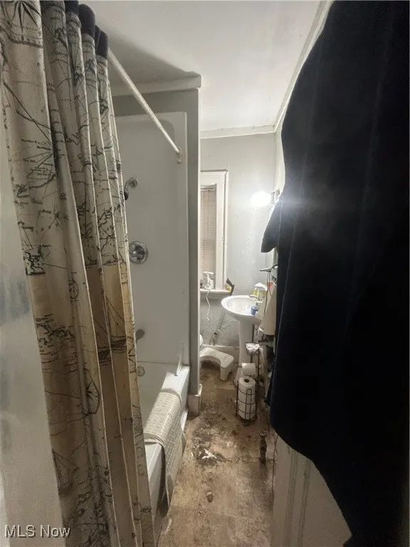 Full bath featuring shower / tub combo