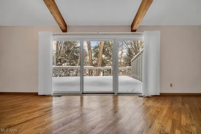 Triple sliding door to deck off great room.  Beautiful view!