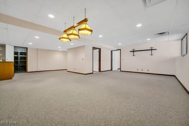 Finished rec room has 2 areas, wet bar with small refrigerator
