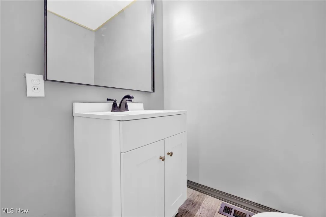 Bathroom featuring vanity and light wood-type flooring