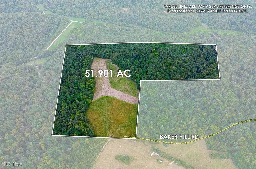Aerial view of property and surrounding area with property parcel outlined