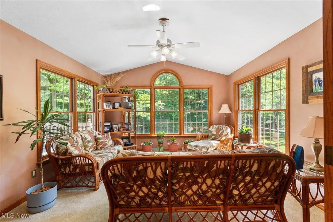 Sunroom with vaulted ceiling