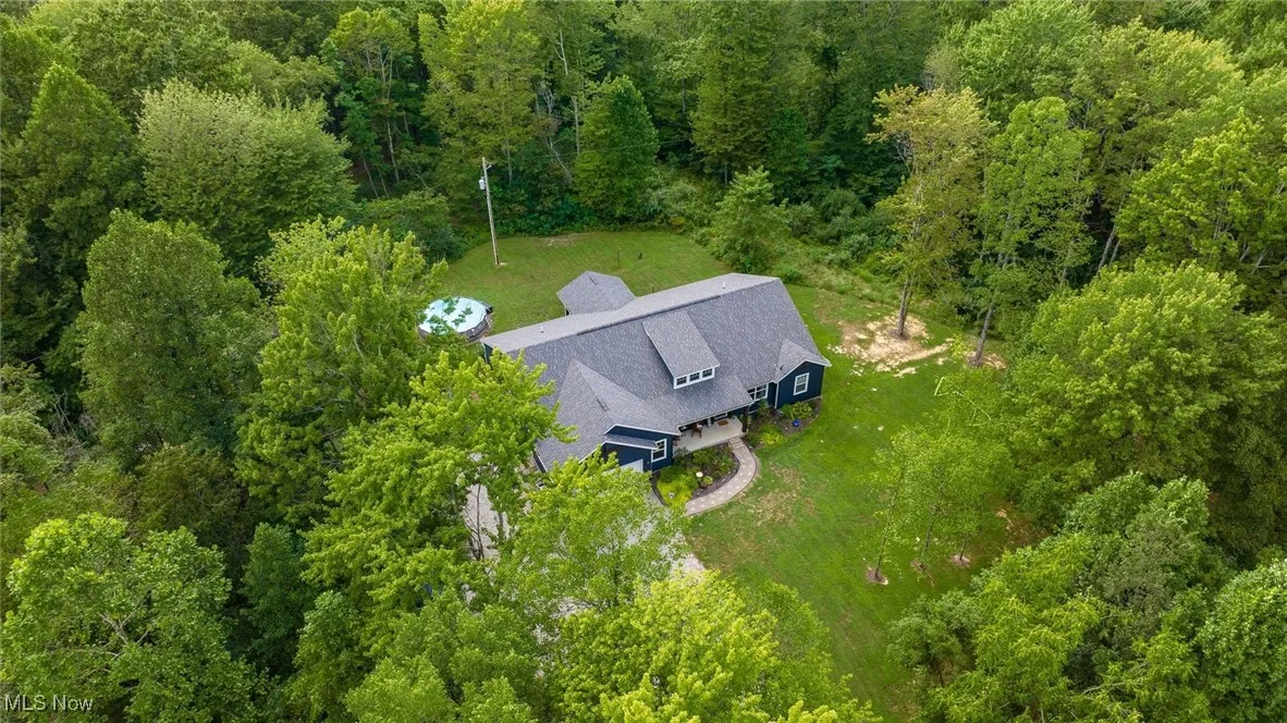 View from above of property featuring a forest