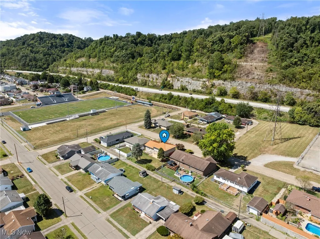 View of property location with nearby suburban area