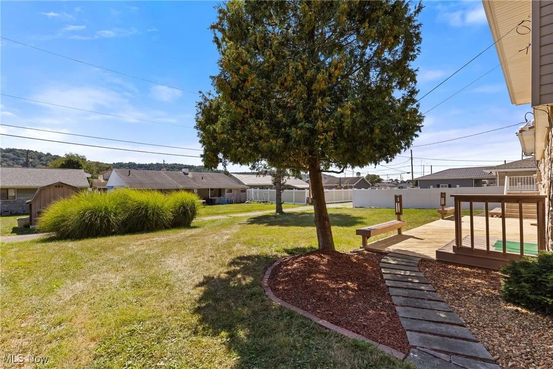 View of yard featuring a deck and a residential view