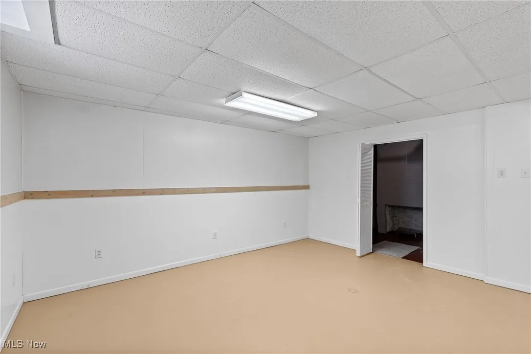 Finished below grade area with a paneled ceiling