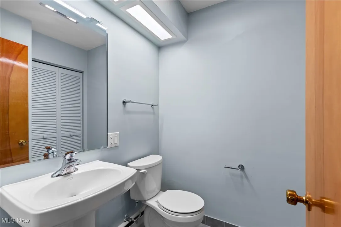 Bathroom with toilet and tile patterned floors