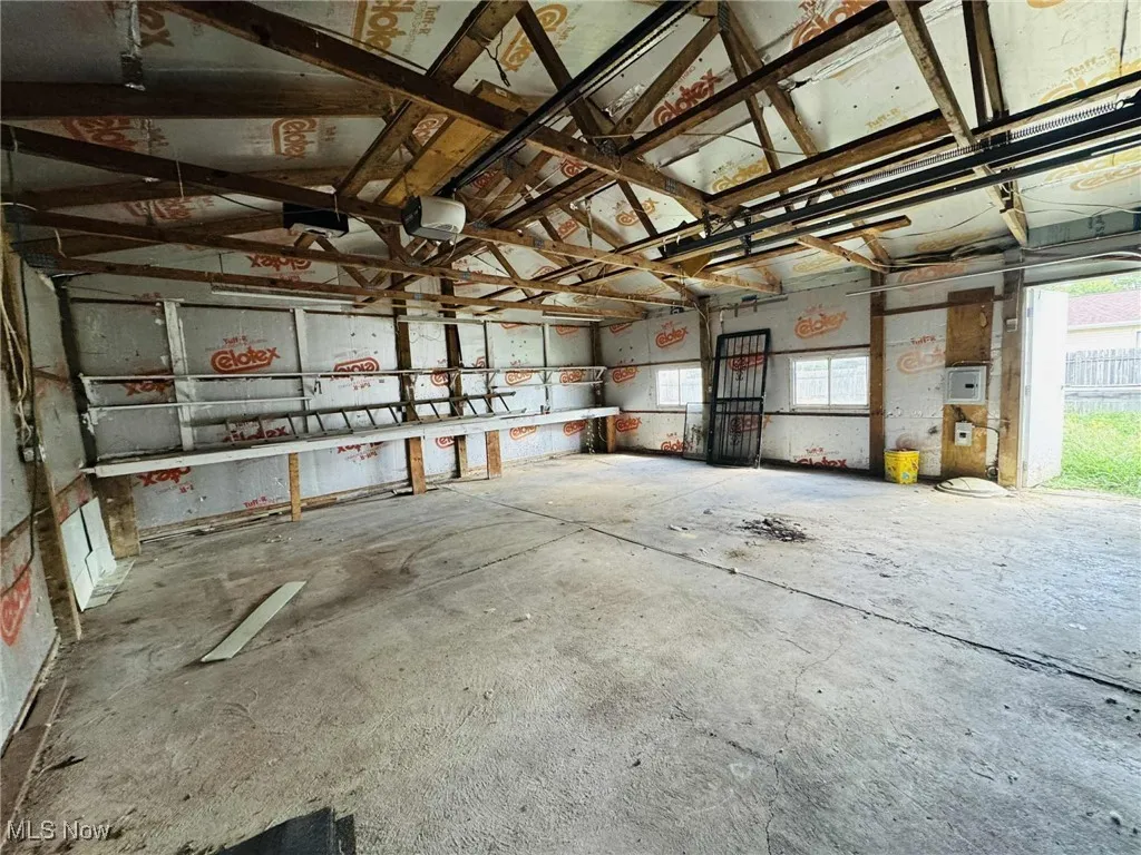 Garage featuring a garage door opener