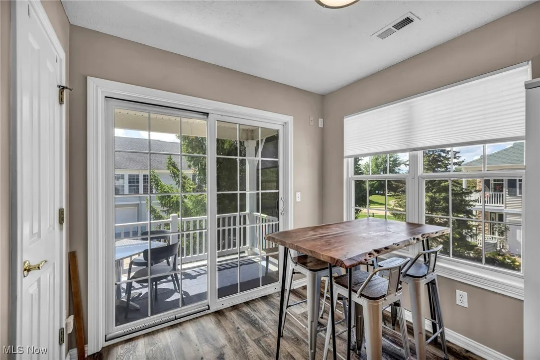 Dining area featuring wood finished floors and baseboards