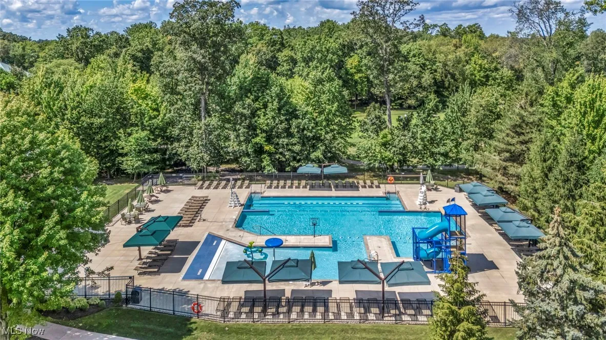 Community pool featuring a patio