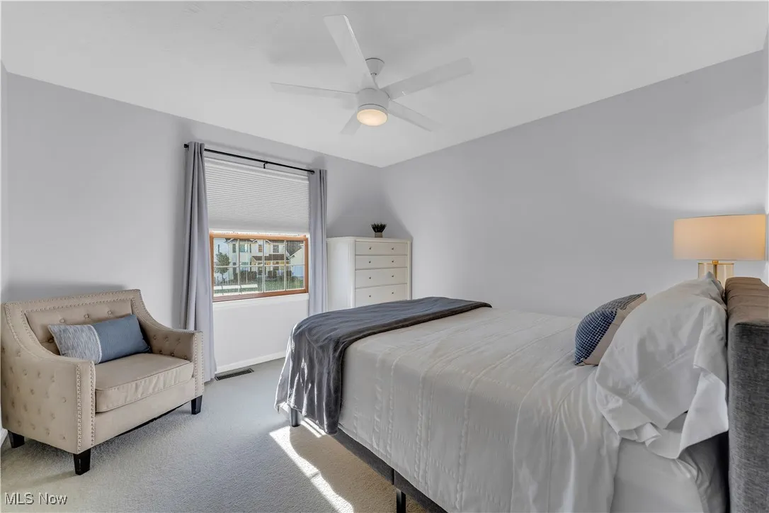 Bedroom with carpet flooring and a ceiling fan