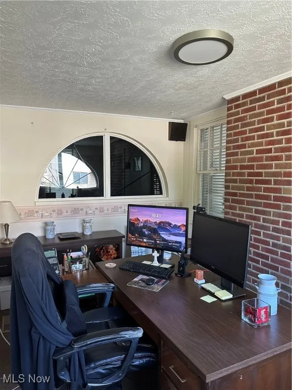 Private office with a textured ceiling