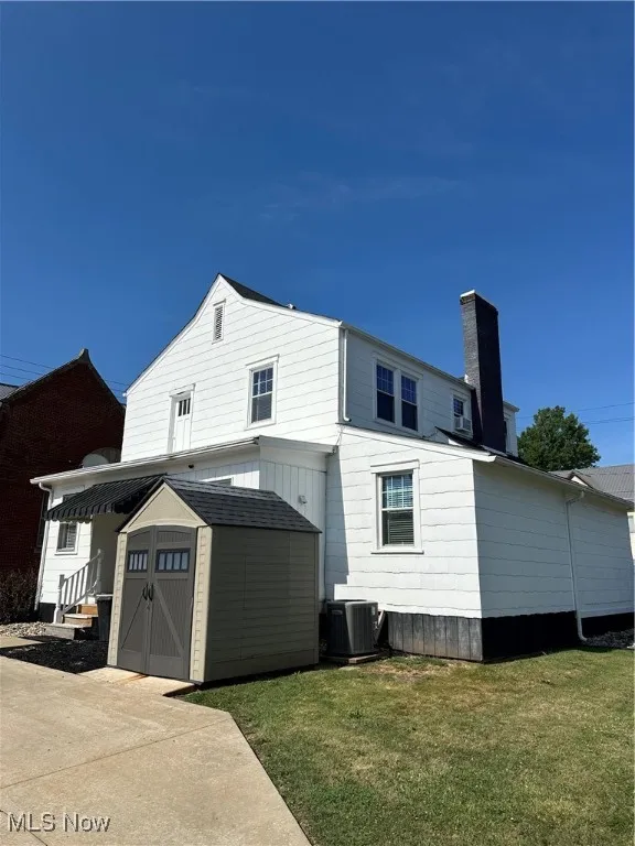 Back of property with shed