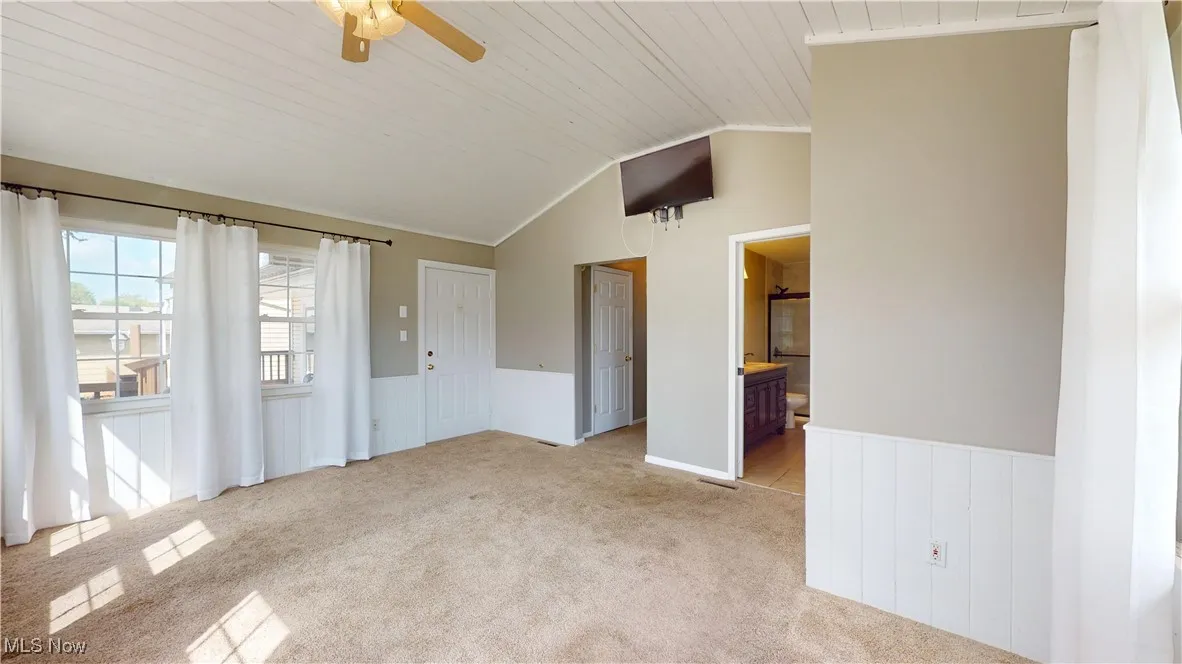PRIMARY BEDROOM WITH ACCESS TO DECK