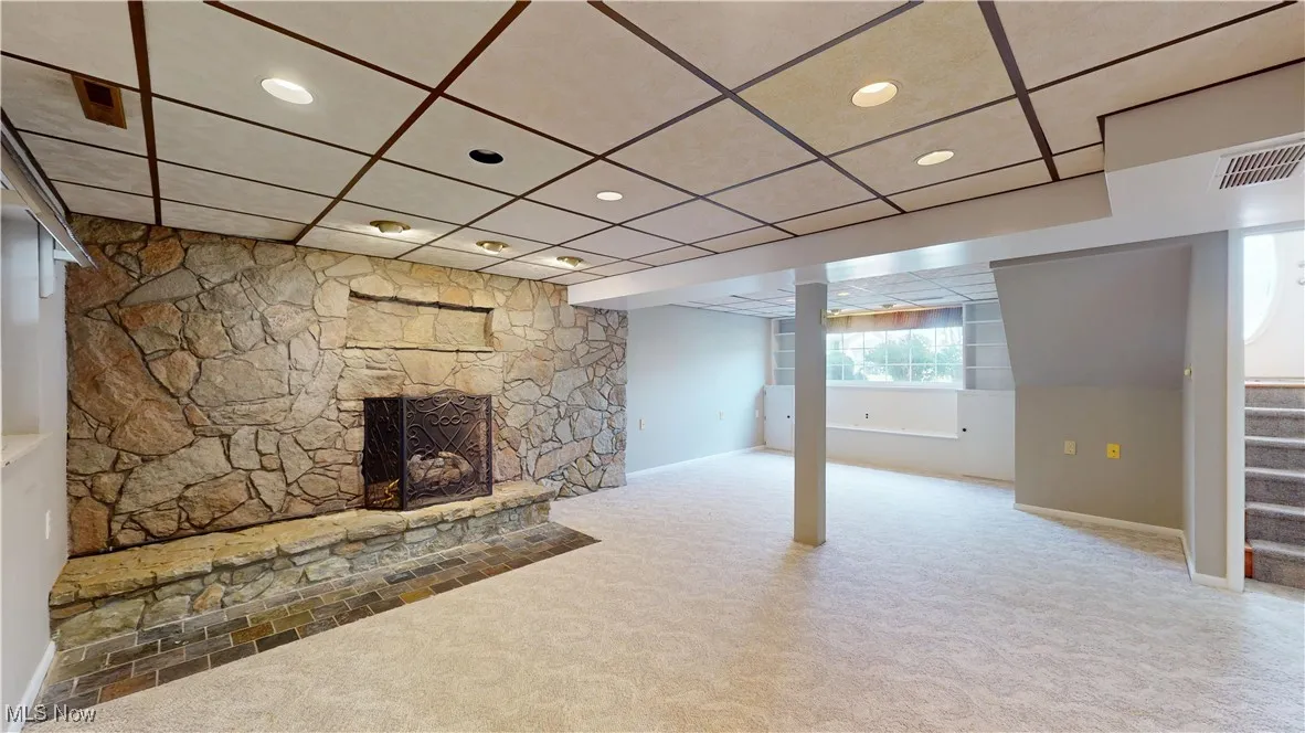 DOWNSTAIRS FAMILY ROOM W WOOD BURNING FIREPLACE