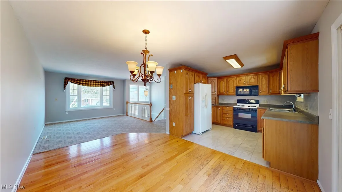DINING AREA OPEN TO KITCHEN AND LIVING ROOM