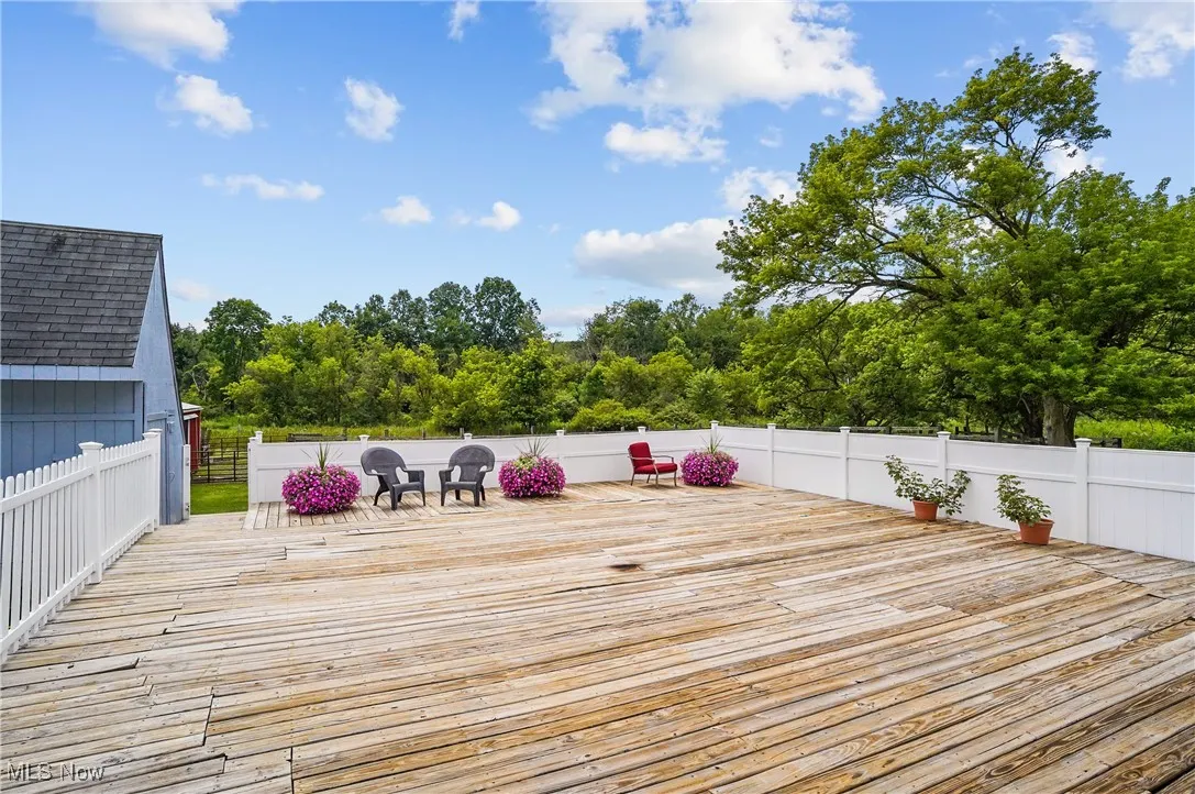 Deck with view of scattered trees