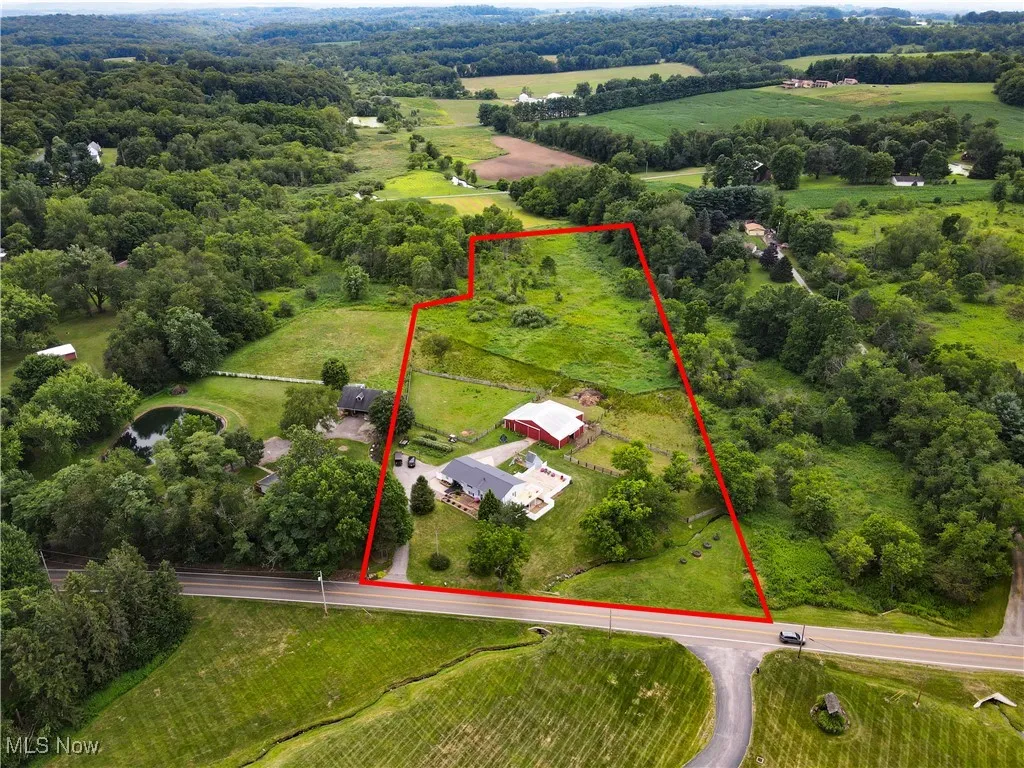 Aerial view of sparsely populated area featuring property boundaries highlighted