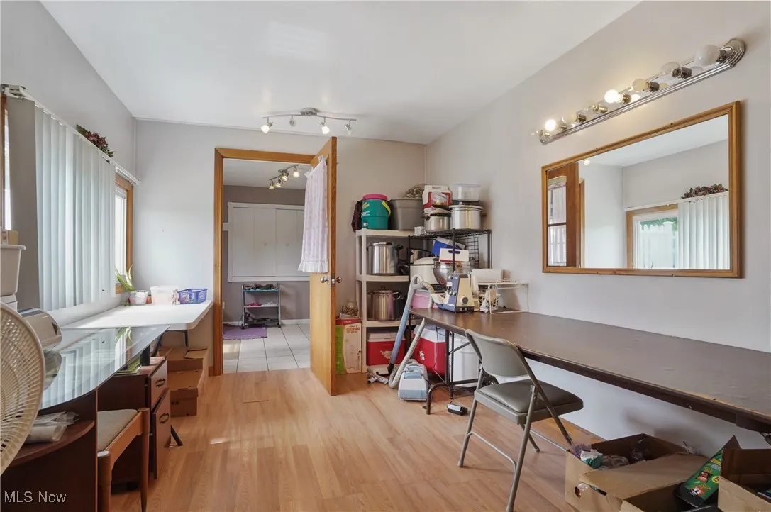 Home office featuring light wood-style floors