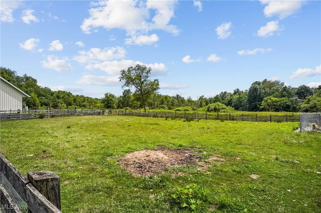 View of yard with a rural view
