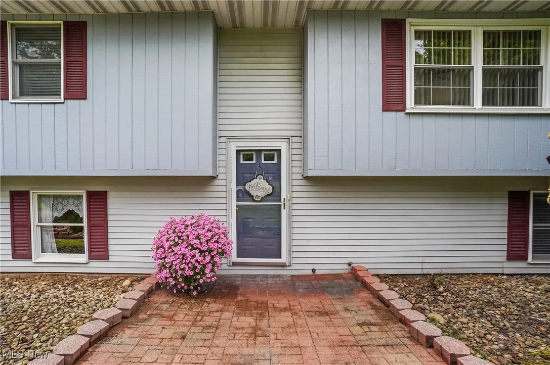Property entrance featuring a patio area