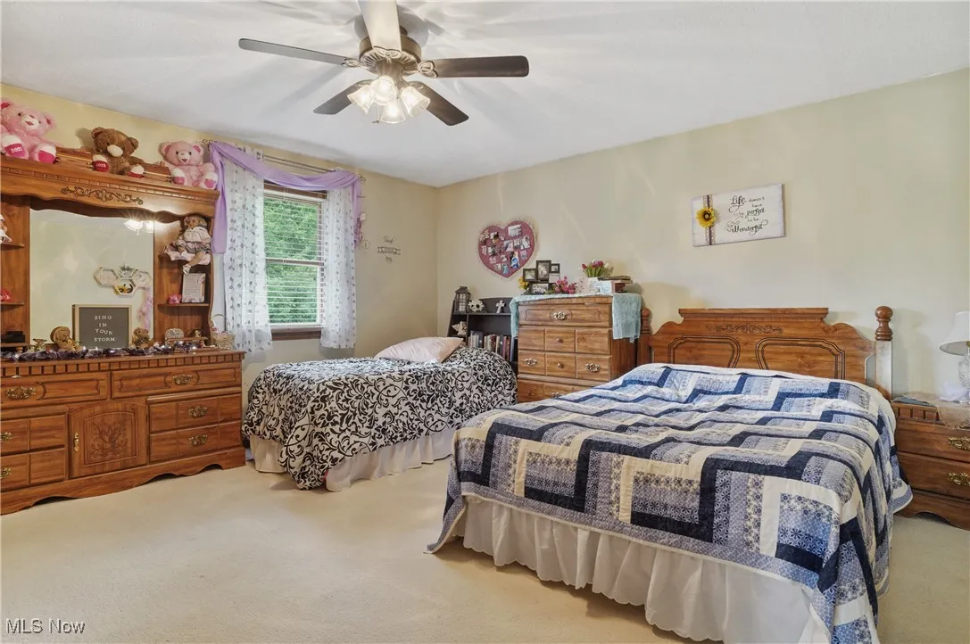 Bedroom featuring carpet flooring and a ceiling fan