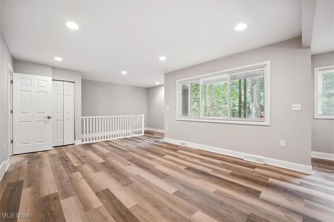 Spare room with recessed lighting and light wood-type flooring