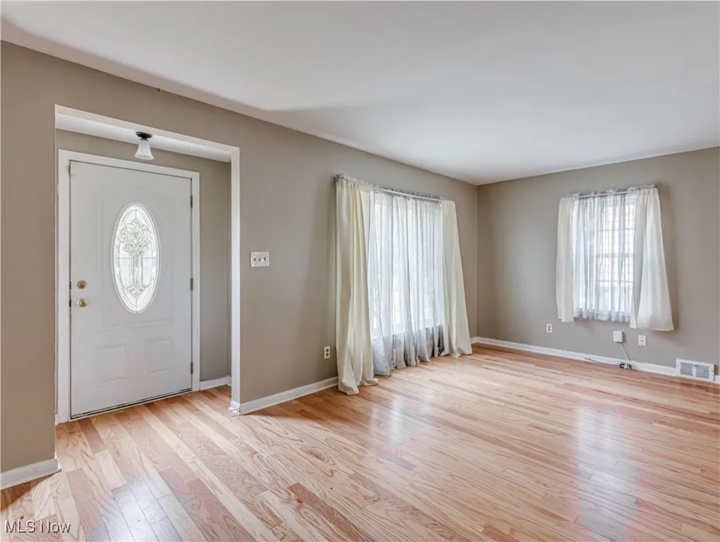 Living Room with plenty of natural light and light wood-style floors