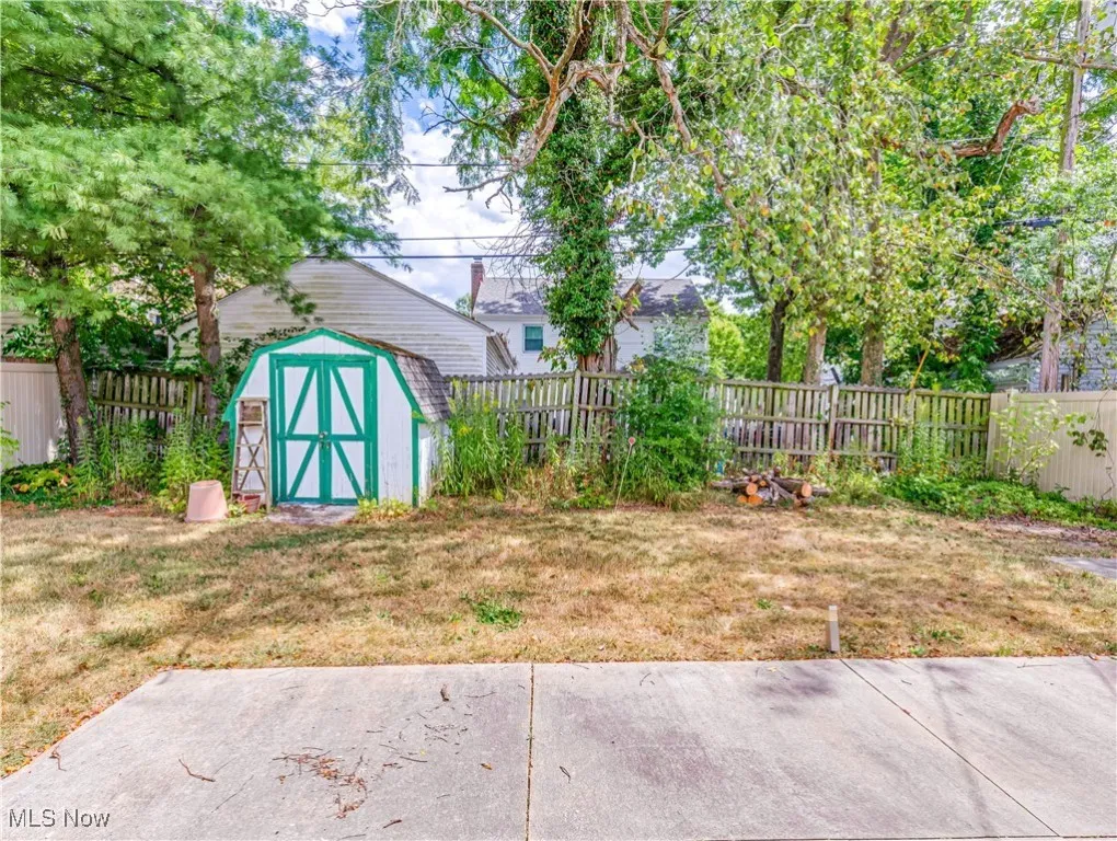 Fenced backyard with a shed