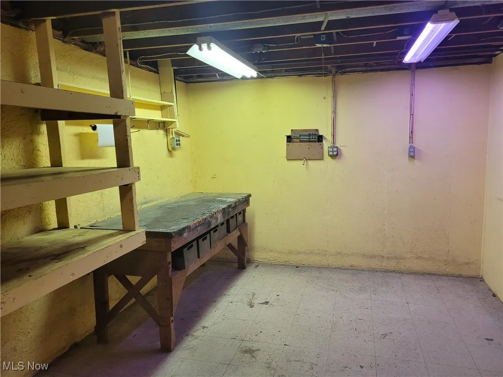 Unfinished basement with tile patterned floors