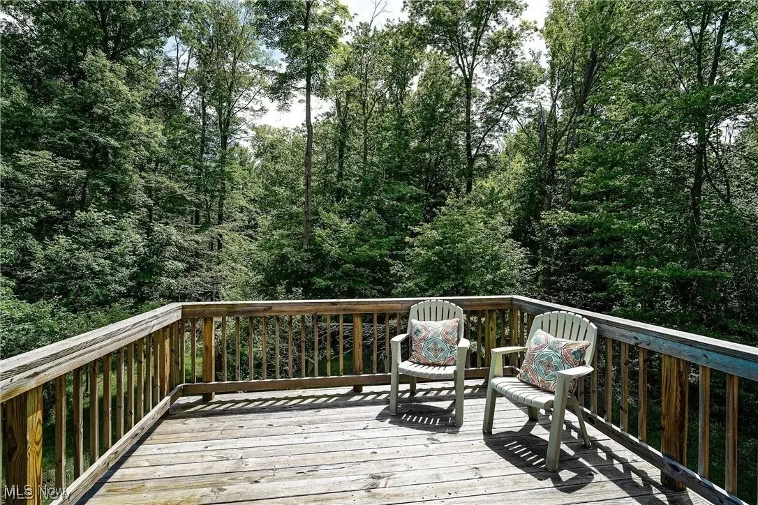 The private deck accessible from the upstairs bedroom