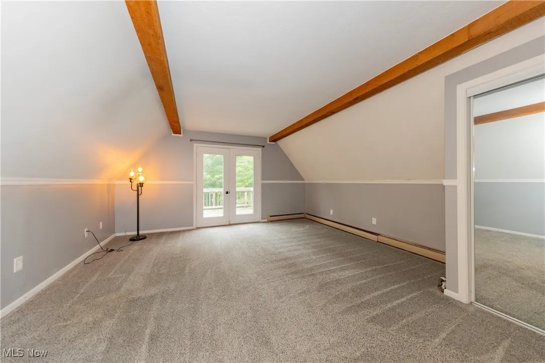 The fourth bedroom is located upstairs on the second floor and features a private deck overlooking the backyard
