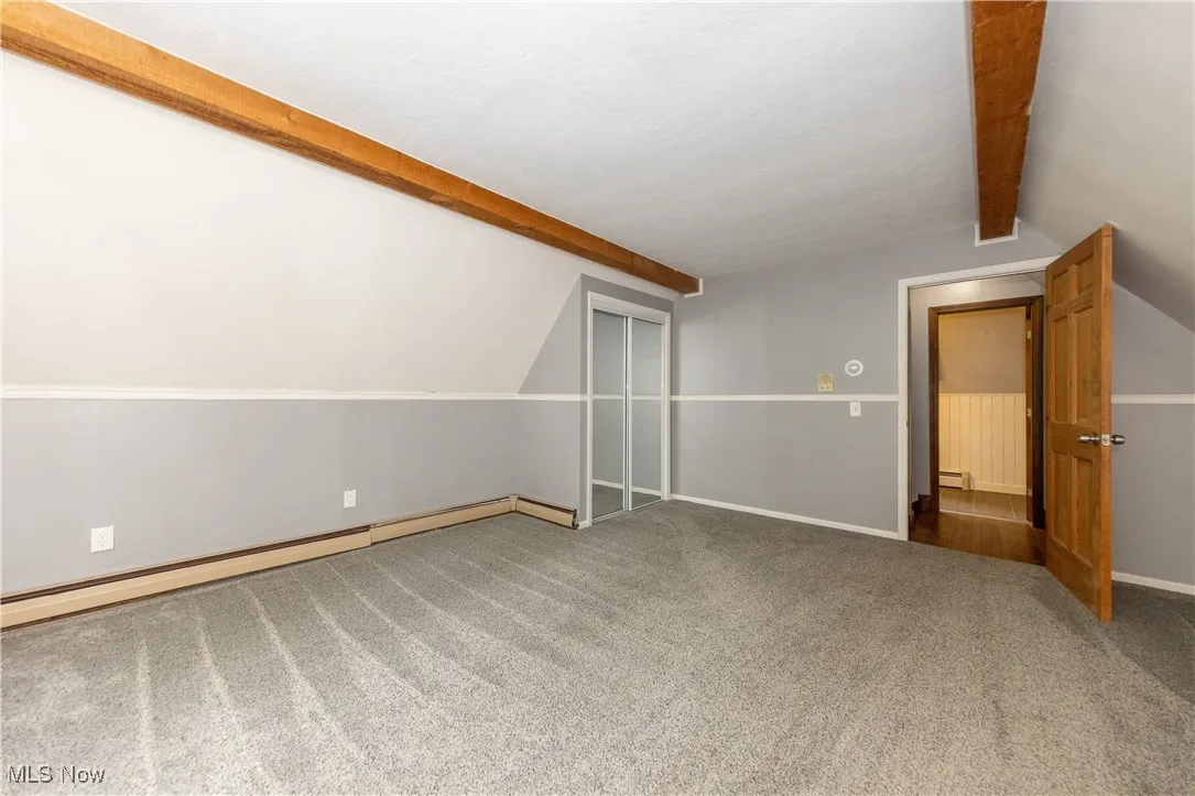 Another view of bedroom #4 located on the second floor and full bathroom beyond