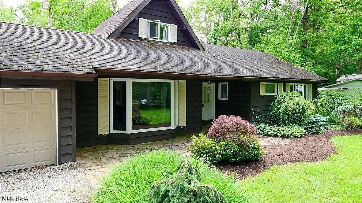 Front of the home with a 2 car attached garage