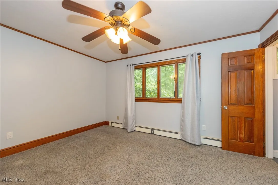 The primary bedroom located on the first floor with ensuite bathroom