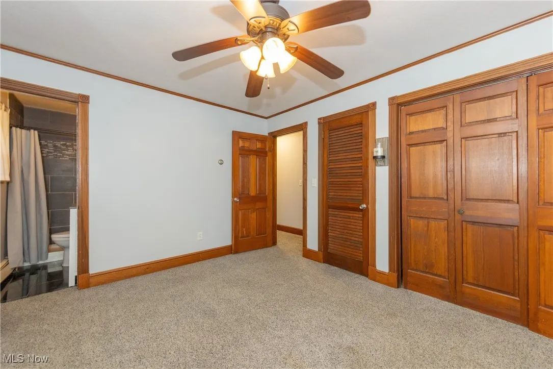 The primary bedroom located on the first floor with ensuite bathroom