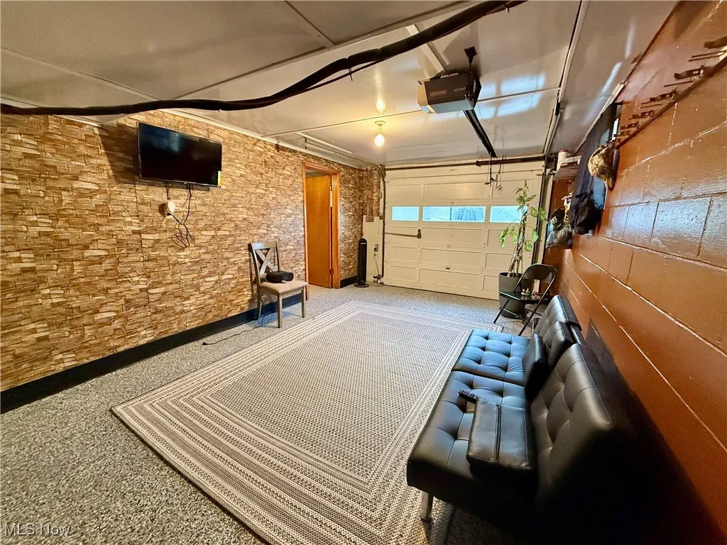 Garage featuring a garage door opener
