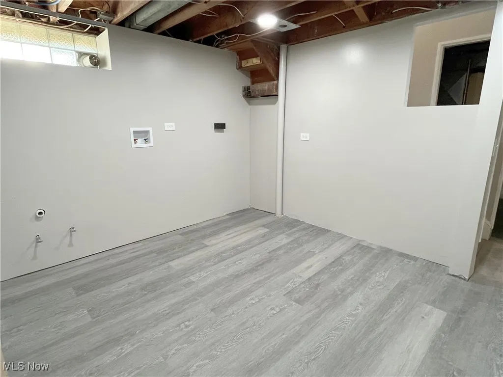 Basement with wood finished floors