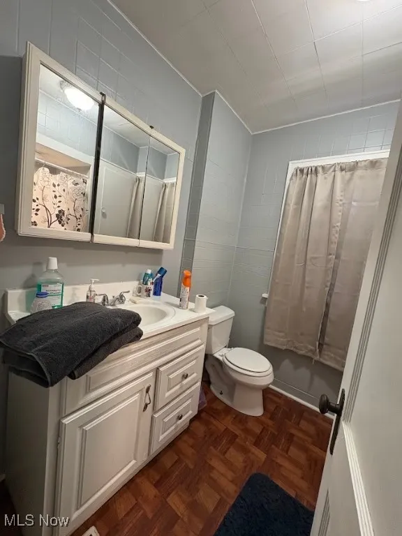 Full bath with vanity and toilet