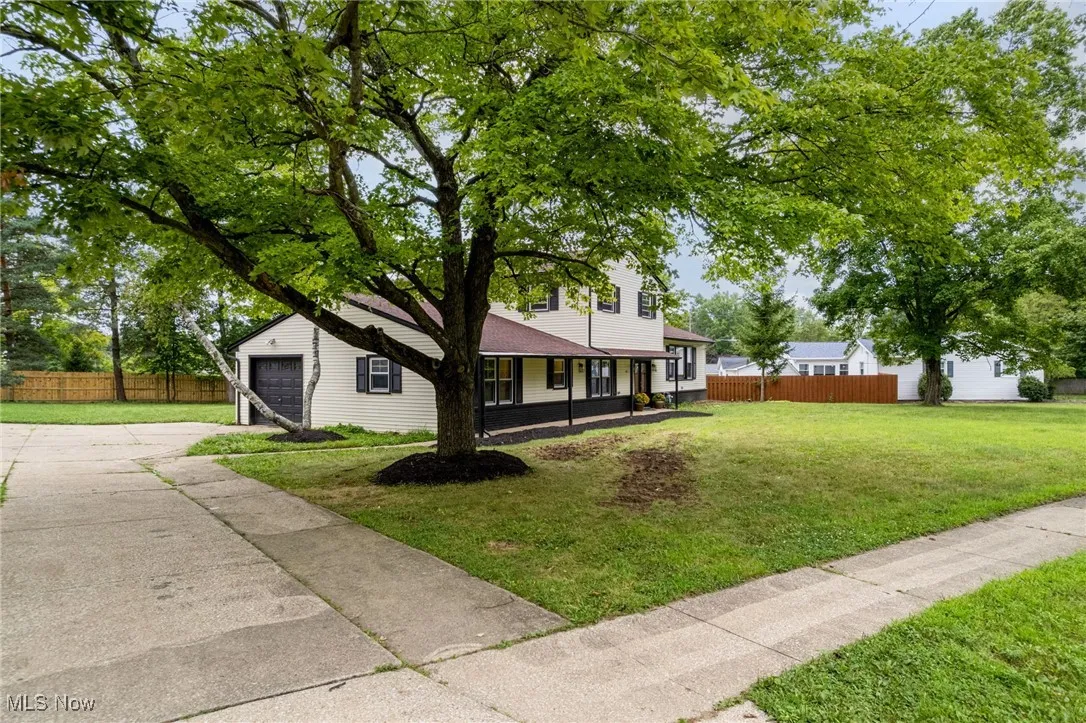 View of front of house with concrete driveway