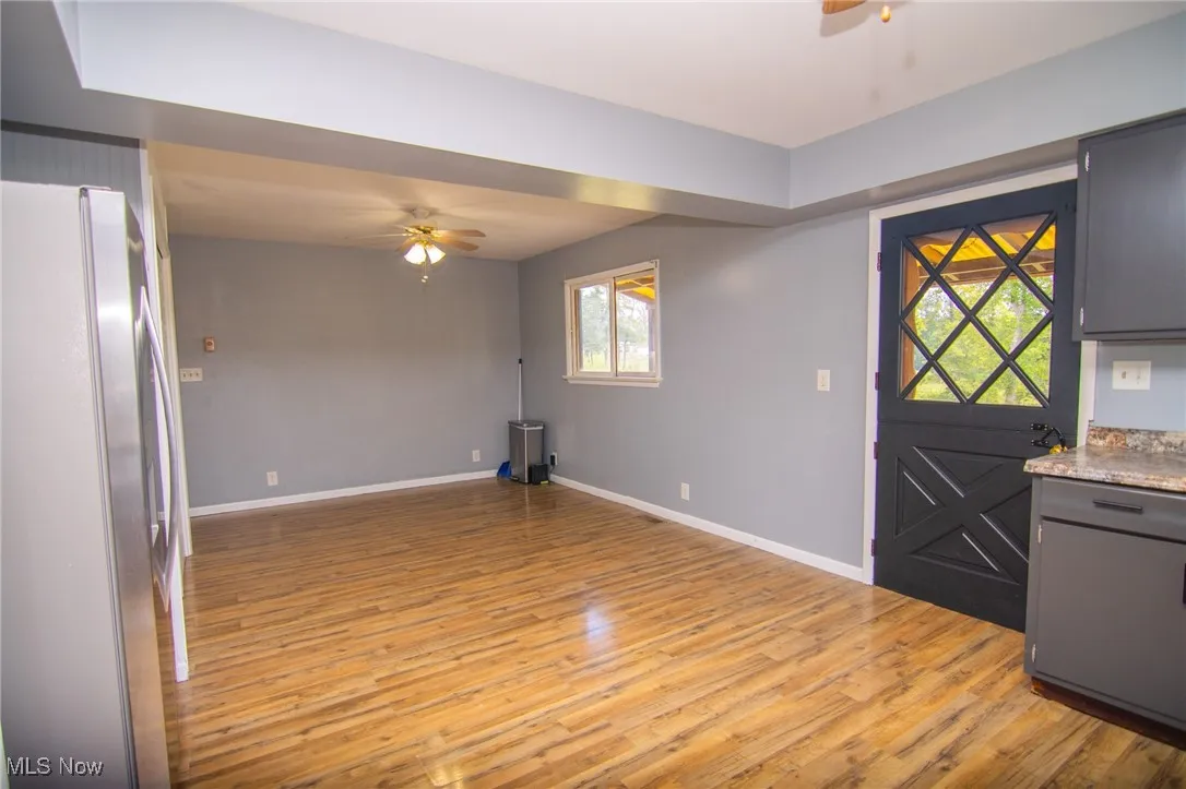 Foyer featuring ceiling fan and light wood-style flooring