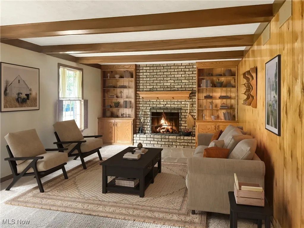 Living area with beam ceiling, a brick fireplace, built in shelves