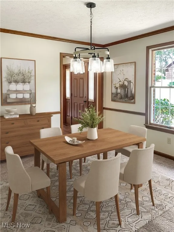 Dining area featuring crown molding, light carpet