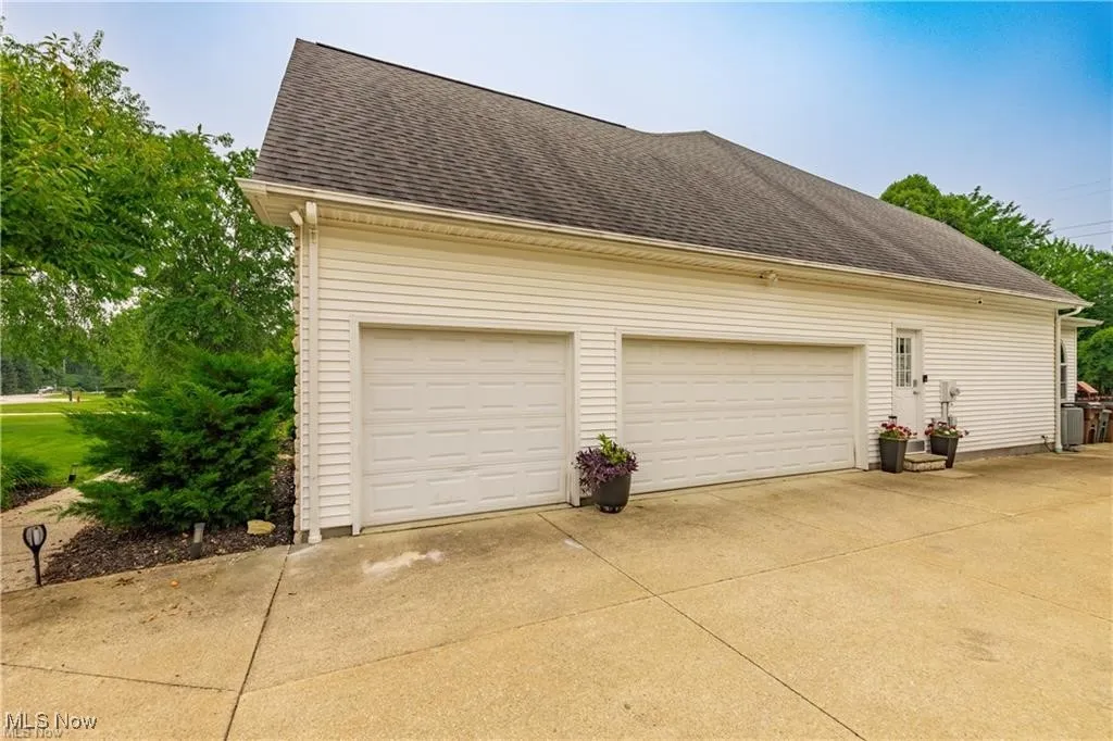 Garage with concrete driveway