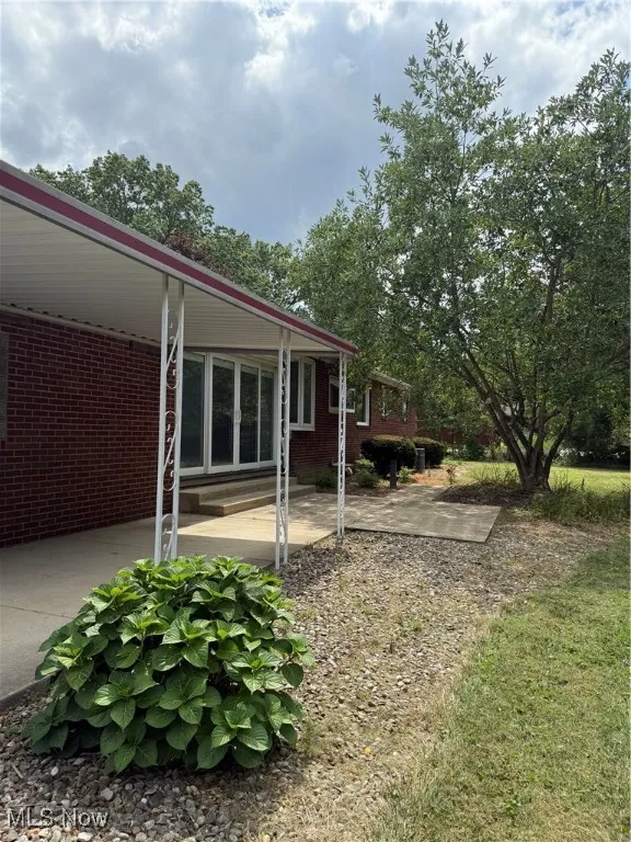 View of yard featuring a patio area and a carport
