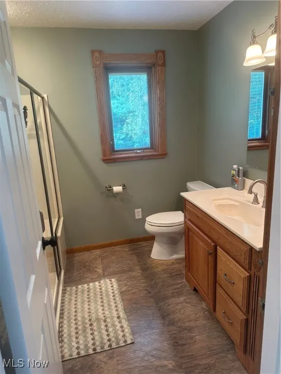 Bathroom with vanity and a shower stall