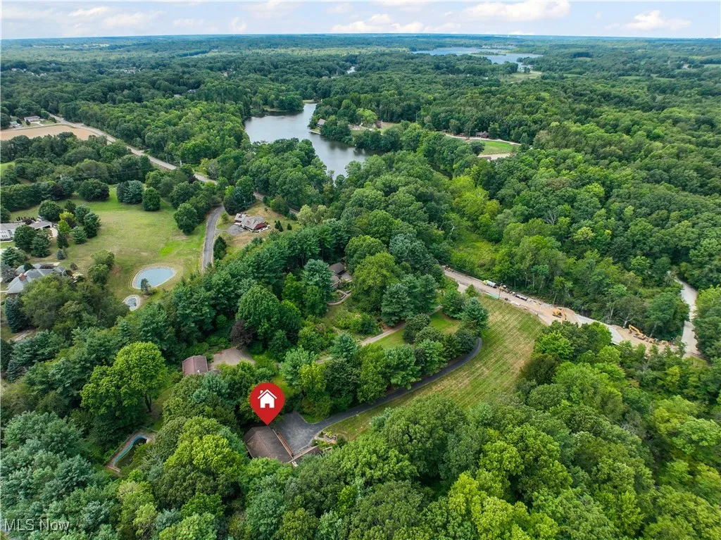 Aerial view of property's location with a forest and view of the old Camp Y-Noah directly across the street